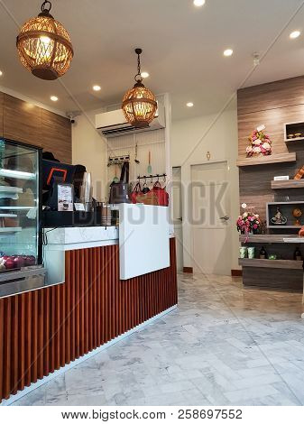 28 August 2018 Pathumthani Thailand : Coffee Shop Interior With Modern Ceiling Lamps And Wooden Bar 