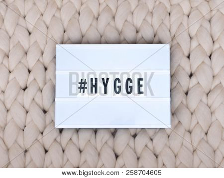 Hygge On A Light Box With Knit Background. Holiday Concept. Cozy Compozition. Merino Wool Handmade K