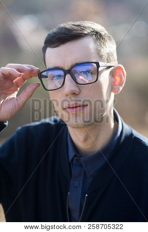 Optic Shop Concept. Optics Shop With Man In Anti-reflection Glasses