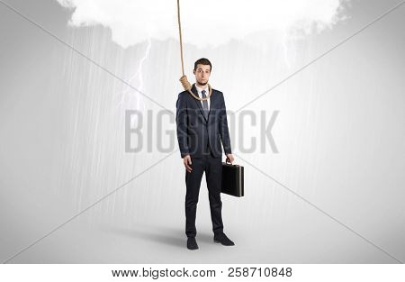 Young businessman trying to suicide with pointing hands concept