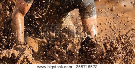 Mud Race Runners During Extreme Obstacle Races
