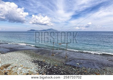 Beautiful Blue Stone Beach In Flores, Indonesia.