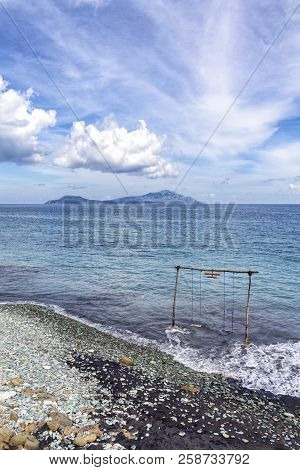 Blue Stone Beach With The Savu Sea In The Background.