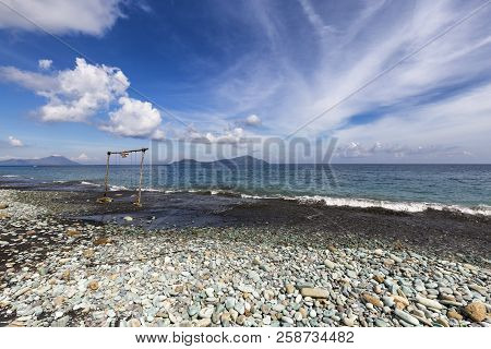 Beautiful Blue Stone Beach In Flores, Indonesia.