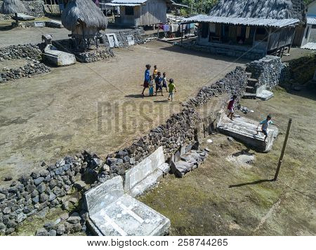 Luba, Indonesia - May 19: Unidentified Run Around In Front Of Traditional Houses On May 19, 2017 In 