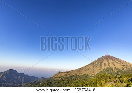 Early Morning Light Hits The Inerie Volcano In Flores, Indonesia.