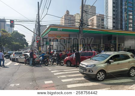 Cars Line In Front Of Gas Station