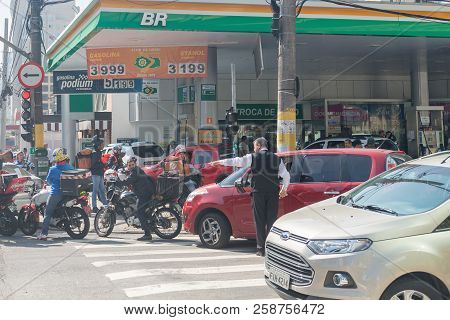 Cars Line In Front Of Gas Station