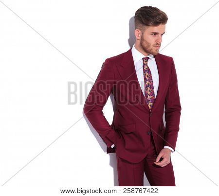 side view portrait of a serious businessman posing on white background