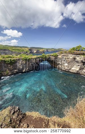 Clouds And Sun Over Broken Beach On Nusa Penida.