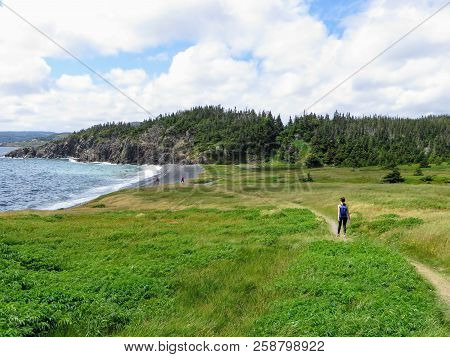 Admiring The Beautiful Sights Of The Skerwink Trail Outside Of Trinity, Along The Rugged Coasts Of N