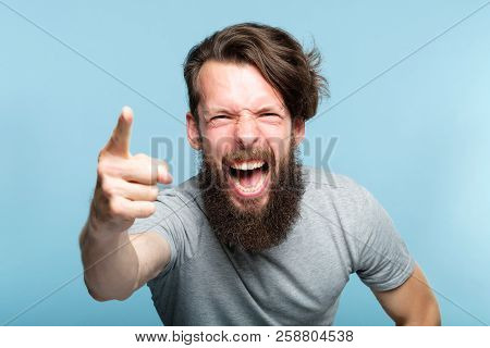 Anger Fury Rage And Accusation Concept. Bearded Man Screaming And Blaming Someone And Pointing Finge