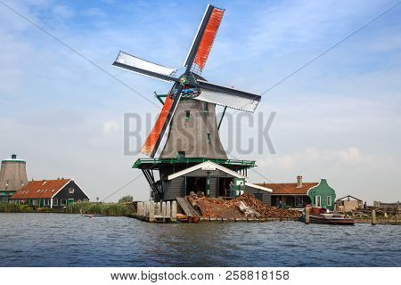 Zaanse Schans, Netherlands, August 19, 2015 - Traditional, Authentic Dutch Windmill At The River Zaa