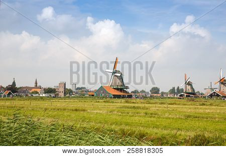 Zaanse Schans, Netherlands, August 19, 2015 - Traditional, Authentic Dutch Windmills At The River Za