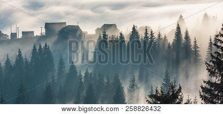 Morning Sunray Through Fog On Slopes Of The Carpathian Mountains (yablunytsia Village, Ivano-frankiv