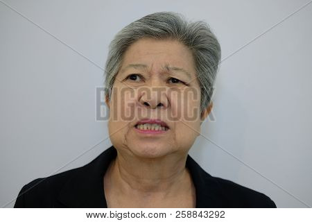 Furious Elder Woman, Enraged Elderly Female. Angry Asian Senior