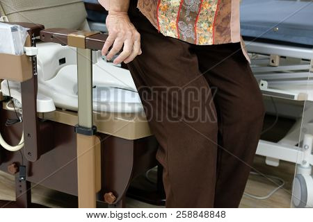 Old Woman Use Portable Mobile Plastic Toilet Near  Patient Bed