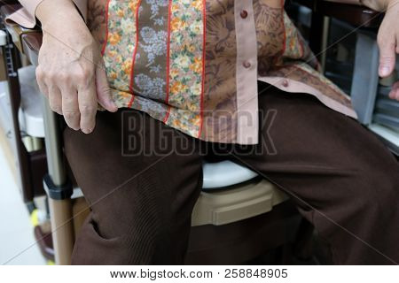 Old Woman Use Portable Mobile Plastic Toilet Near  Patient Bed