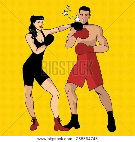The War Of The Sexes. Beautiful Girl Boxer Hitting Her Handsome Opponent With A Left Hook
