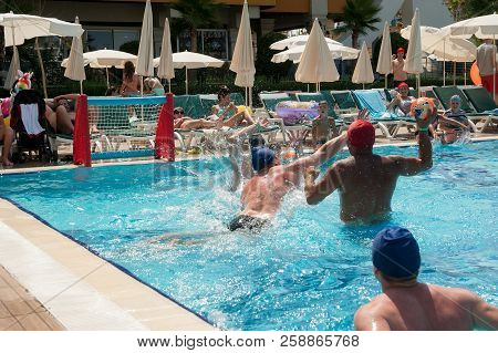 Turkler, Turkey - July 30, 2018: A Group Of People Playing In The Pool In A Water Polo Ball. Athlete