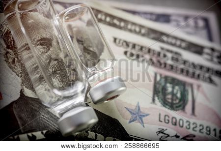Vials With Different Substances Over Dollar, Concept Of Copayment