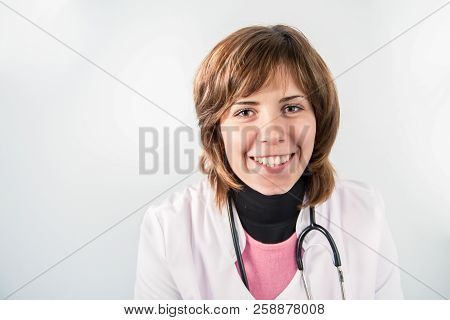 Smiling Woman Medic With Binaural Stethoscope On White