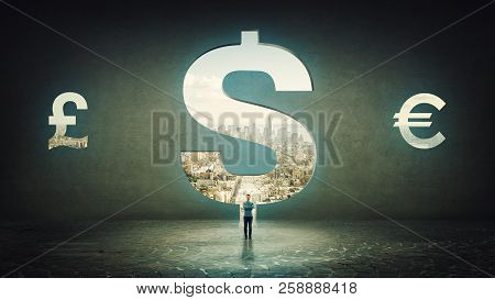 Confident Businessman With Crossed Hands Standing Alone In Front Of A Dollar Sign Hole As A Door Sha