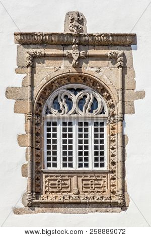 Window in the Manuelino style (Portuguese Gothic) from the Coimbras House. Braga city, Portugal.