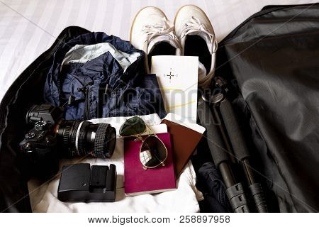 Top View Of Traveling Accessories In White Background.
