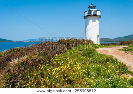 Lighthouse On Sardinian Coast Near Maristella, Near The City Of Alghero, In A Sunny Day