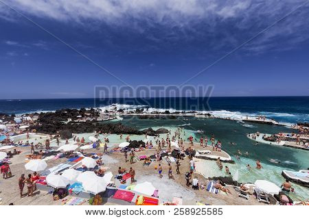 Porto Moniz, Portugal - August 7: Unidentified People Relax At The Piscinas Naturais Or Natural Ocea