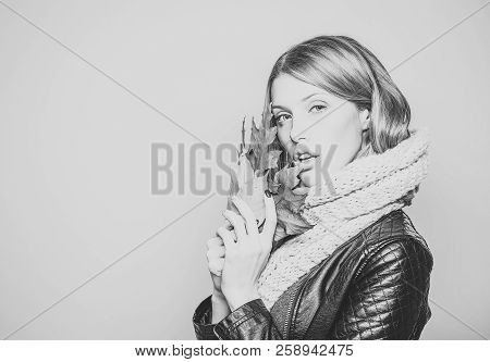 Season And Autumn Holiday. Beauty And Fashion. Woman With Autumn Leaves In Leather Jacket. Fashion M