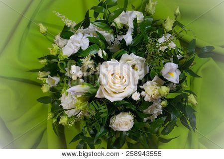 Luxury Wedding Bouquet On A Green Background. Elegant Composition Of Roses. Close-up View Of A Vibra