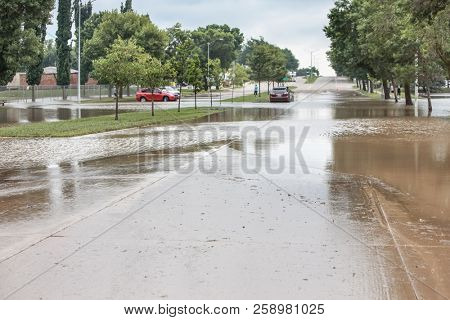 Stormwater flooding over the streets with stalled cars