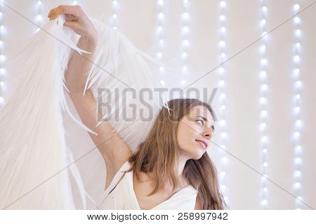 Girl In White Dress With Angel Wings On White Background. Angel-woman
