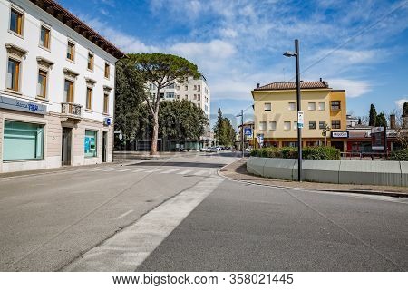 Manzano, Italy - 25.03.2020: Little Italian City During An Epidemic. Deserted Streets. Closed Bank A