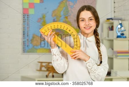 Mired In Geometry. School Girl Hold Protractor Rule. Instrument Of Measurement. Different School Ele