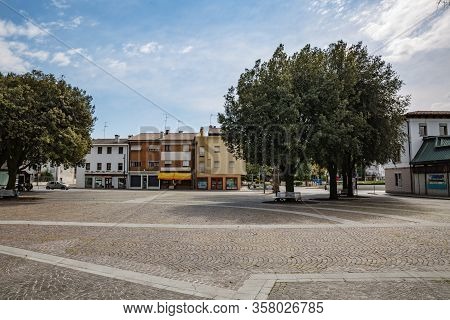 Manzano, Italy - 25.03.2020: Little Italian City During An Epidemic. Deserted Central Square. No Peo