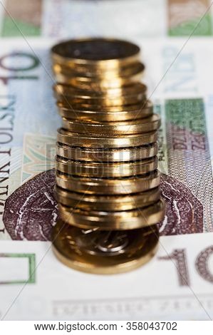Cash Or Polish Money In Coins That Lie On Ten-lot Notes, Details Of The National Currency Of Poland
