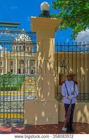 Santo Domingo, Dominican Republic - March 13, 2020: Soldier In Front Of The National Palace, A Build