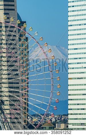 Yokohama Ferris Wheel Cosmo Clock 21 And Fuji Mountain In Japan