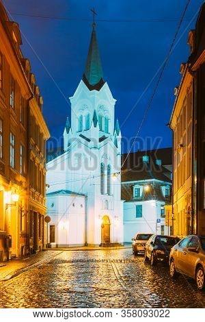 Riga, Latvia - July 3, 2016: White Tower With Pyramidal Spire Of Our Lady Of Sorrows Or Virgin Of An