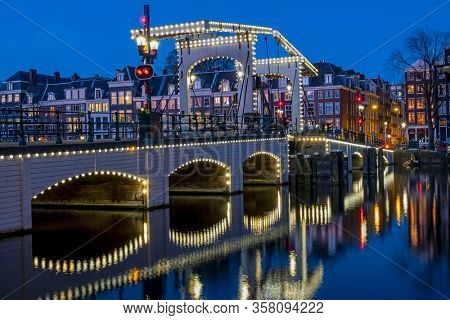 The Tiny Bridge at sunset in Amsterdam the Netherlands