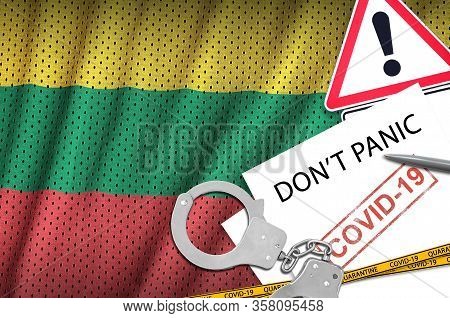 Lithuania Flag And Police Handcuffs With Inscription Dont Panic On White Paper. Coronavirus Or 2019-