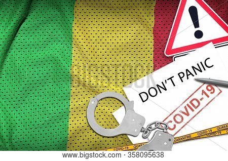 Mali Flag And Police Handcuffs With Inscription Dont Panic On White Paper. Coronavirus Or 2019-ncov 