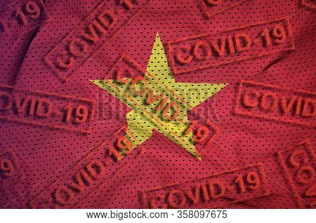 Vietnam Flag And Many Red Covid-19 Stamps. Coronavirus Or 2019-ncov Virus Concept