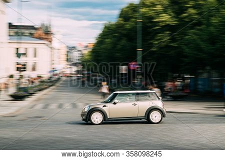 Oslo, Norway - June 24, 2019: Mini Hatch Second Generation R56 Fast Driving In City Street.