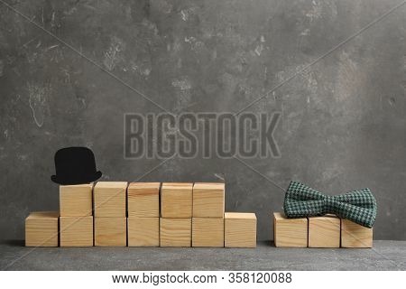 Phrase Happy Father's Day Made With Wooden Cubes On Grey Stone Background. Space For Text