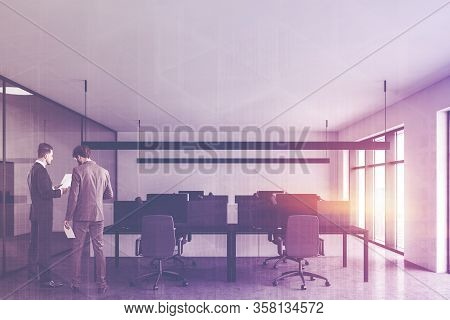 Two Businessmen Talking In Modern Open Space Office With White And Glass Walls, Concrete Floor And R