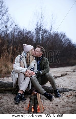 Winter Picnic On Baech With Bonfire. Love Story On Winter Foggy Sand Beach. Valentines Concept.